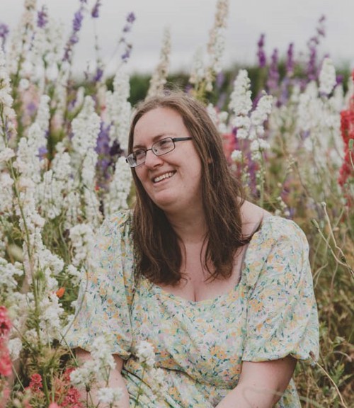 Woman sat in confetti field